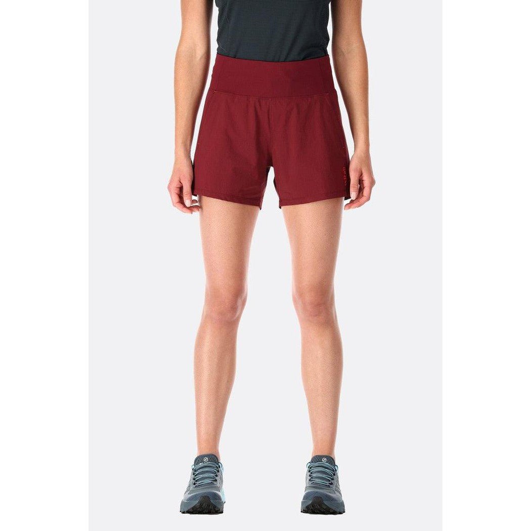 A front view of the Rab Women's Momentum Shorts in Beluga color, showing the high waist and model wearing them against a plain white background.