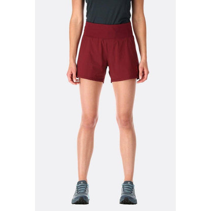 A front view of the Rab Women's Momentum Shorts in Beluga color, showing the high waist and model wearing them against a plain white background.