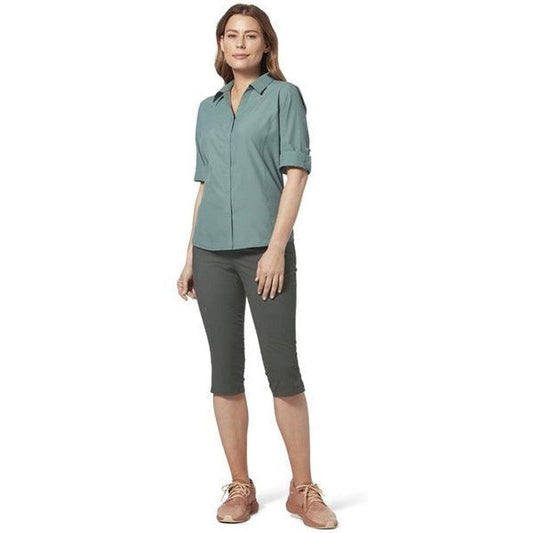 A woman wearing the Royal Robbins Women's Jammer II Capri in Asphalt stands against a white background.