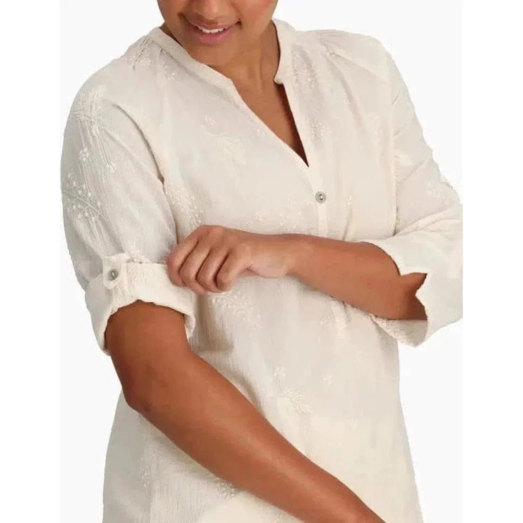 A woman models the Royal Robbins Women's Oasis II 3/4 Sleeve top in Navy, showing the rolled-up sleeve and button detail against a plain white background.