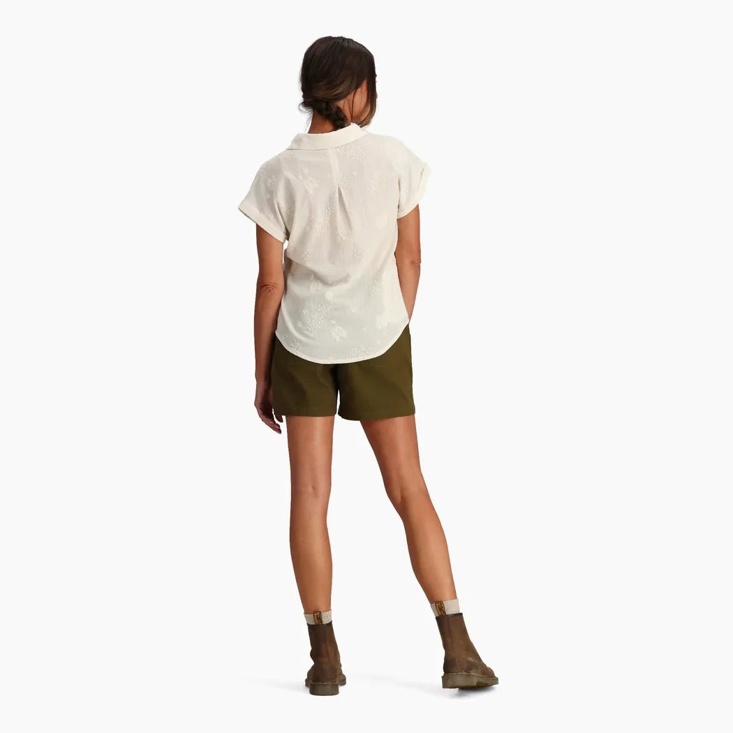 Back view of the Royal Robbins Women's Oasis Short Sleeve in Wild Rhubarb on a model against a white background.