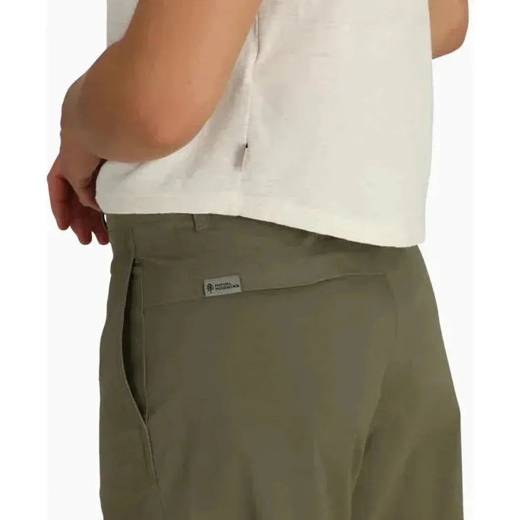 Side view of the Royal Robbins Women's Wilder' Pant in EverGlade showing the back pocket and a model wearing it against a white background.