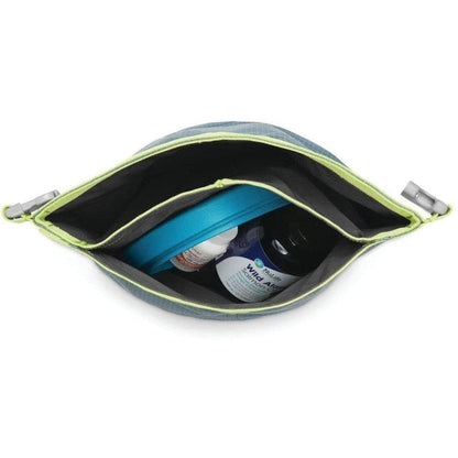 A top-down view of the Ruffwear Kibble Kaddie in Slate Blue showing its interior with a blue container and a bottle inside against a white background.
