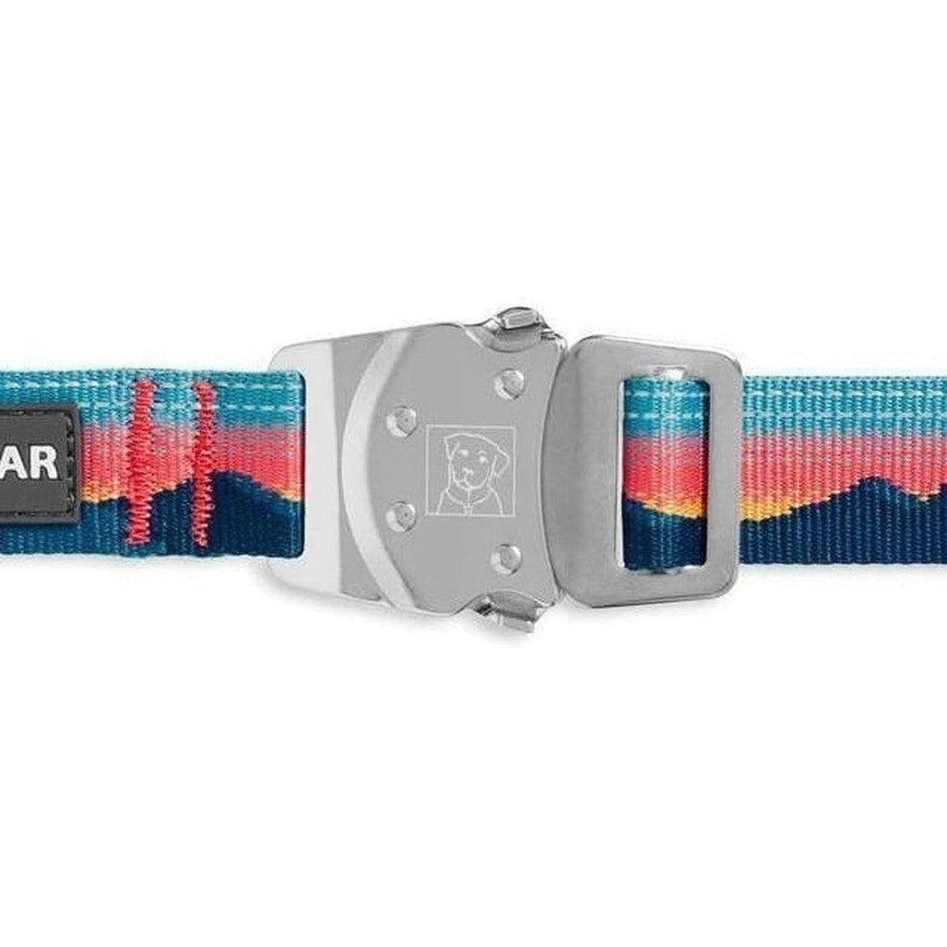 A close-up of the Ruffwear Top Rope Collar in Sunset color showing the metal buckle and colorful strap pattern against a white background.