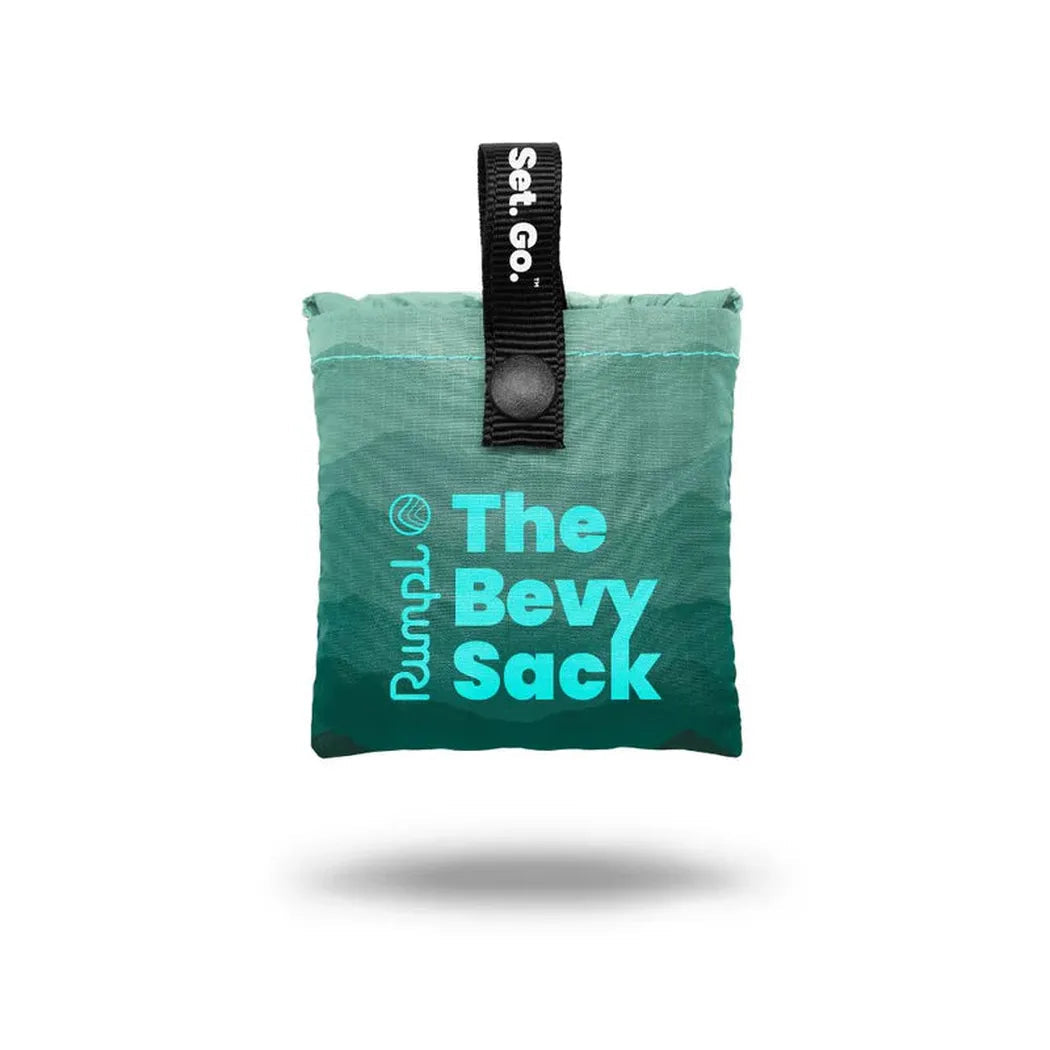A top-down view of the Rumpl Bevy Sack in Baja Fade with a black Set. Go. strap and a white background.