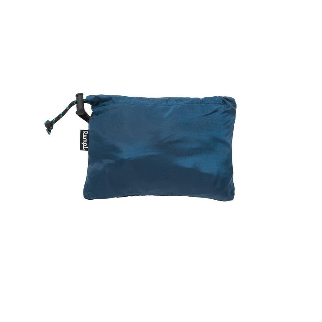 A close-up of the Rumpl Stuffable Pillow in Deepwater color with a drawstring closure and brand tag, photographed against a plain white background.