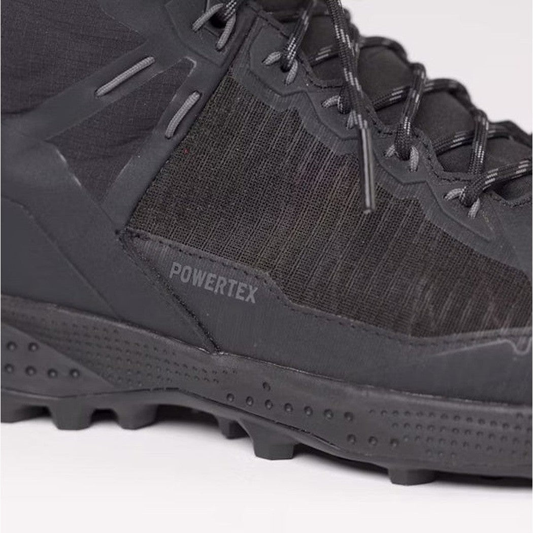 A close-up side view of the Salewa Women's Pedroc Pro Powertex Mid Boot in Black/Black showing the lugged outsole and "Powertex" branding.