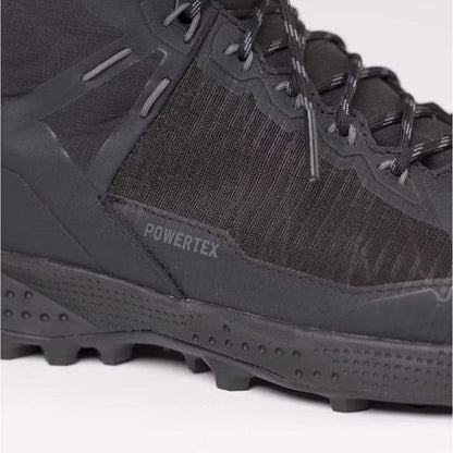 A close-up side view of the Salewa Women's Pedroc Pro Powertex Mid Boot in Black/Black showing the lugged outsole and "Powertex" branding.