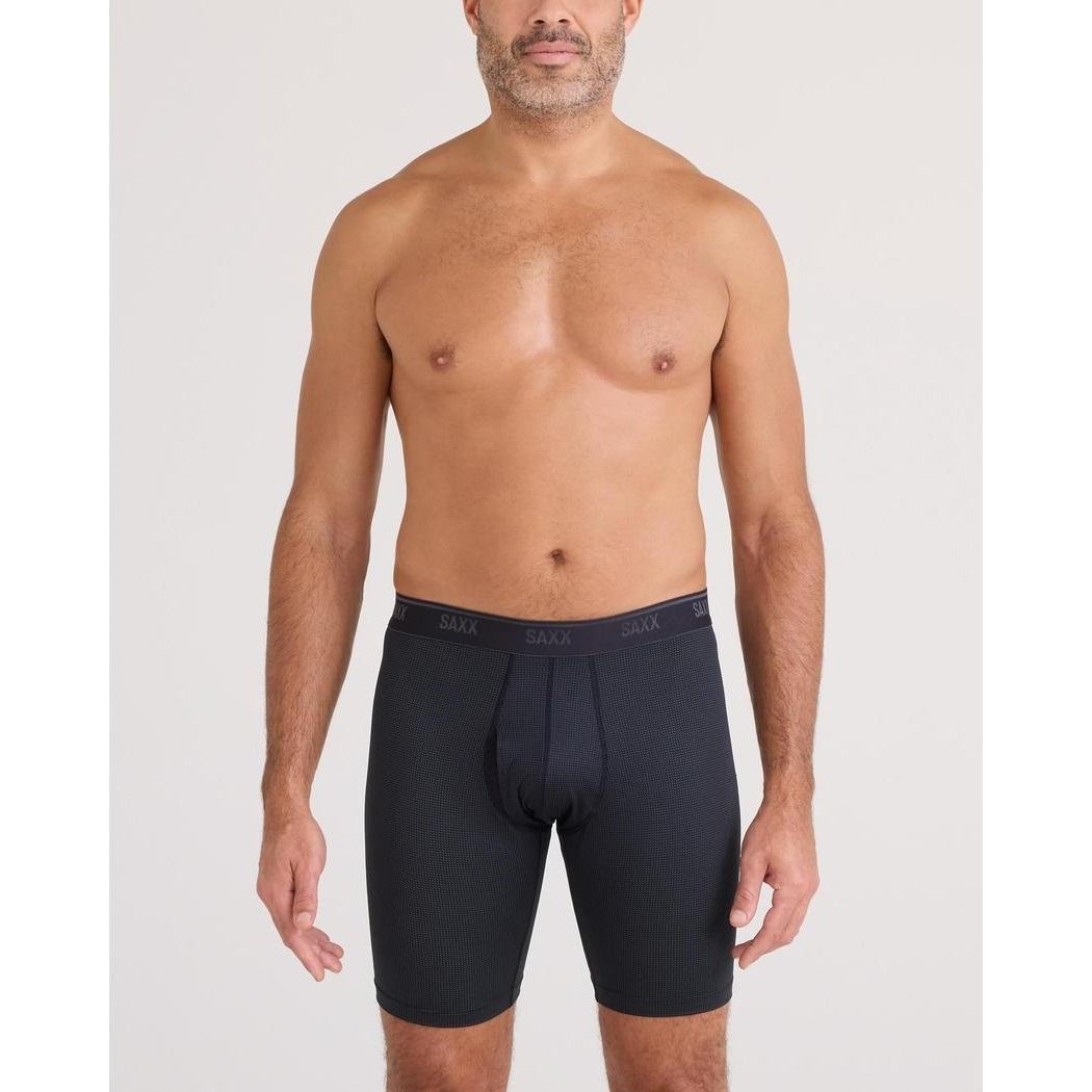 A front view of the SAXX Quest Quick-Dry Mesh Long Boxer Brief Fly - 8" in Black on a model against a plain white background.