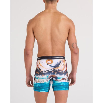 Back view of the SAXX Volt Breathable Mesh Boxer Brief - 6" in GreatMigrationM showing the ocean scene print on a model against a plain background.