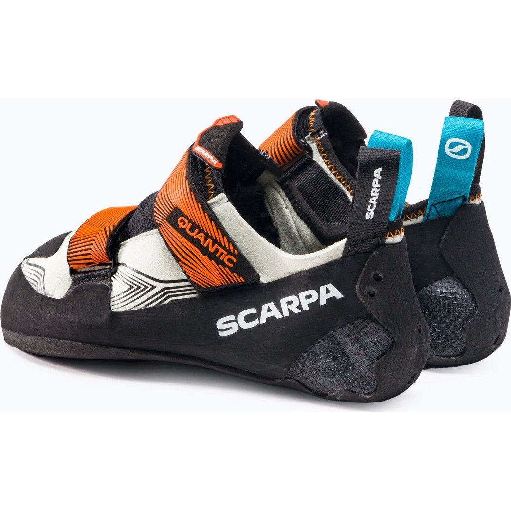 Side view of the Scarpa Men's Quantic climbing shoes in Dusty Grey/Mango with orange straps and a black sole against a white background.