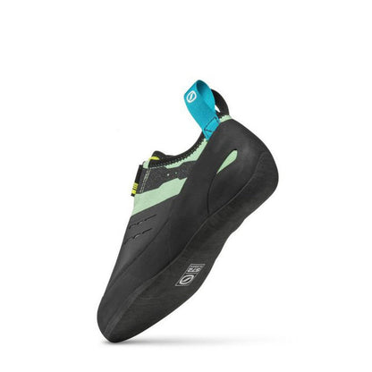 Side view of the Scarpa Origin VS Wmn climbing shoe in PastelGreenLime with a blue pull tab against a white background.
