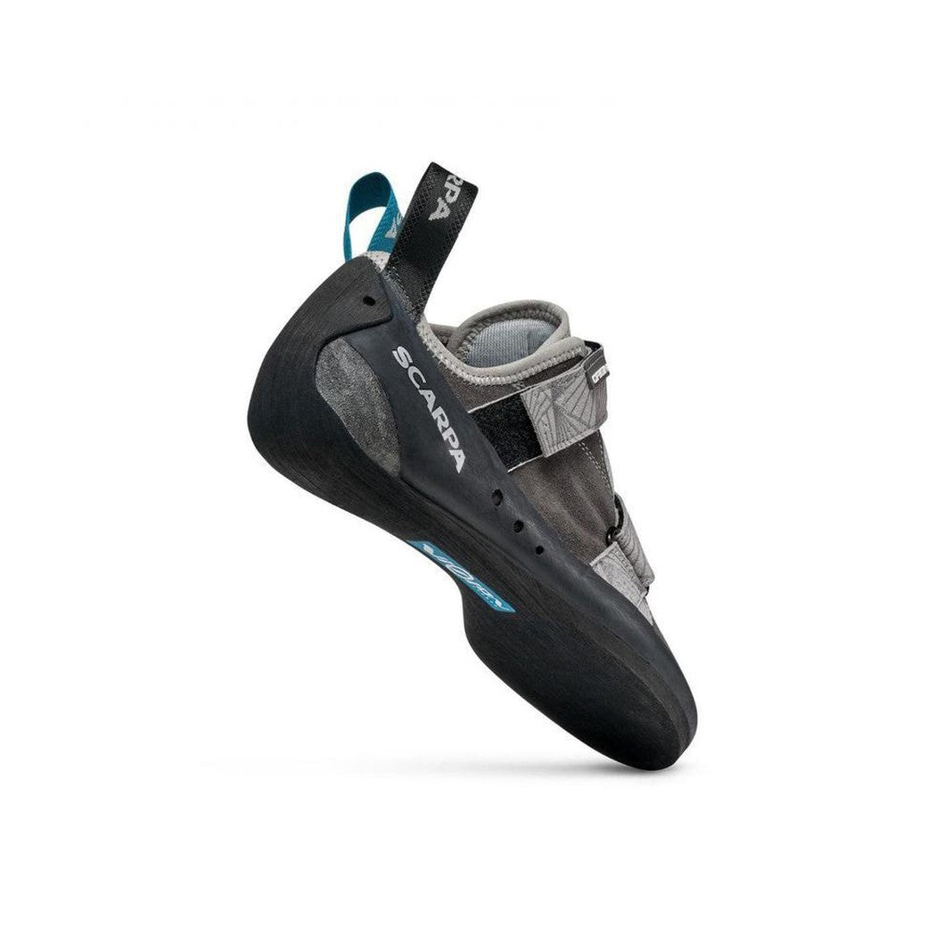 A side view of the Scarpa Origin Covey/Black climbing shoe with a strap and a white background.