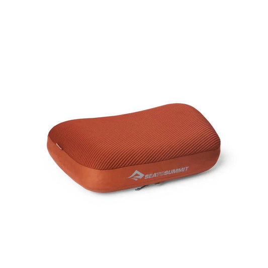 A side view of the Sea To Summit Aeros Premium Pillow in Burnt Olive against a white background.