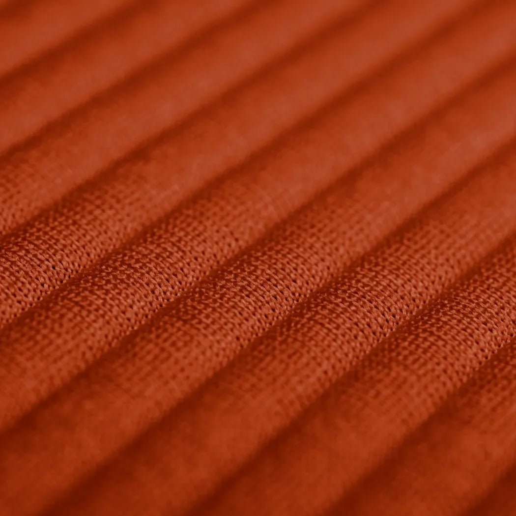 Close-up of the Sea To Summit Aeros Premium Pillow in Burnt Olive showing the textured fabric surface.