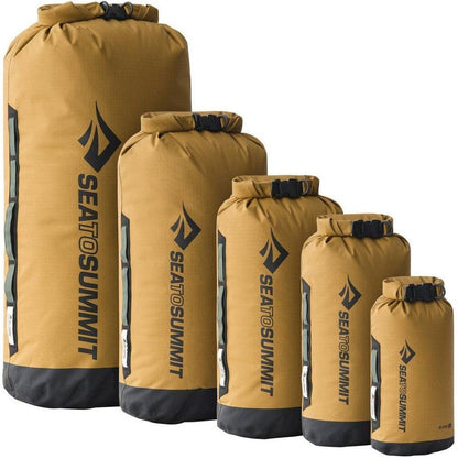 Five Sea To Summit Big River Dry Bags in Gold Brown from smallest to largest on a white background.