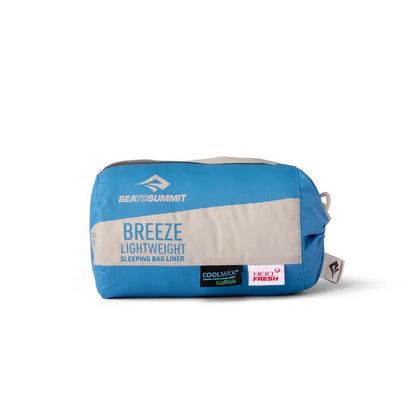 A front view of the Sea To Summit Breeze Lightweight Sleeping Bag Liner in blue with a beige panel and Coolmax and Hydro Fresh labels against a white background.