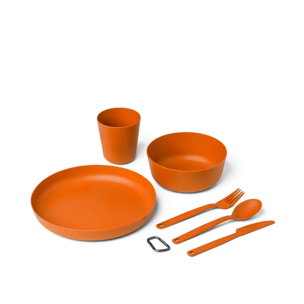 Burnt orange Sea To Summit Camp Dinnerware Set w/ Mesh Sack - [6 Piece] laid out on a white background.