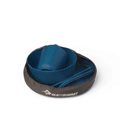 A top-down view of the Sea To Summit Camp Dinnerware Set with Mesh Sack in Burnt Orange, showing the mesh bag and contents against a white background.
