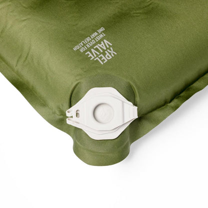 A close-up of the Sea To Summit Camp Plus Self Inflating Mat in Regular Green showing the valve and text on the top.