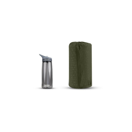 A side view of the Sea To Summit Camp Plus Self-Inflating Sleeping Mat in Charcoal/Graphite next to a water bottle on a white background.