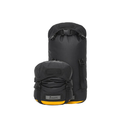 Two Jet Black Sea To Summit Evac Heavy Duty Compression Dry Bags sit against a white background, one larger than the other.