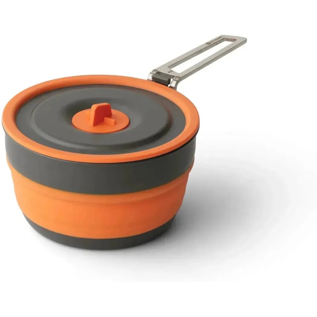 A top-down view of the Sea To Summit Frontier UL Collapsible Pot - 1L with its orange and charcoal/gray color scheme and metal handle, set against a white background.