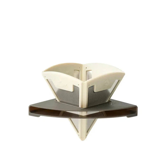 A top-down view of the Sea To Summit Frontier UL Collapsible Pour Over with a charcoal base and cream top against a white background.