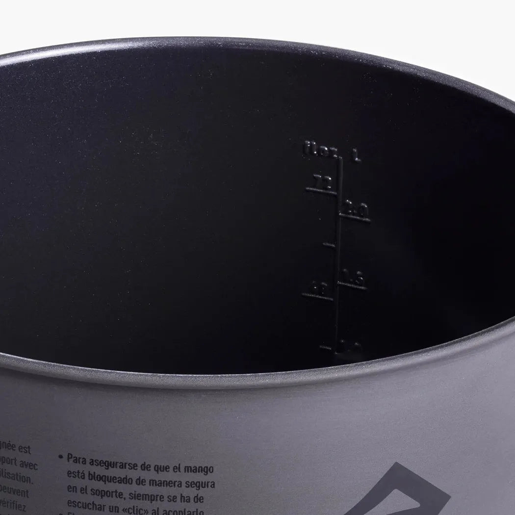 The interior of the Sea To Summit Frontier UL Pot - 1.3L shows measurement markings and text on the exterior rim.