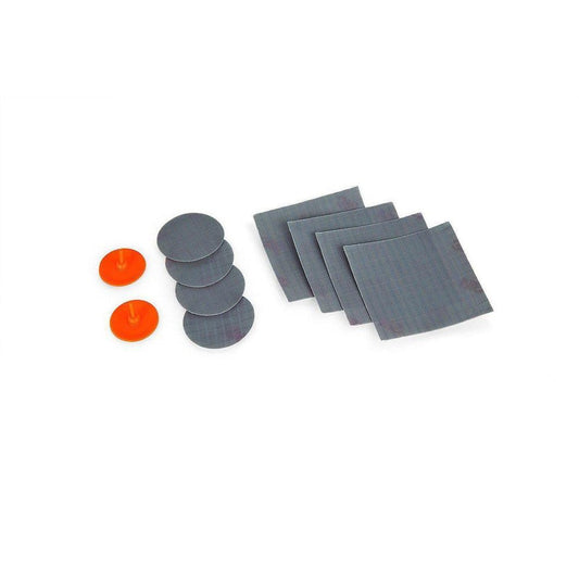 A Sea To Summit Mat Repair Kit photo showing charcoal/gray patches and orange fasteners against a white background.