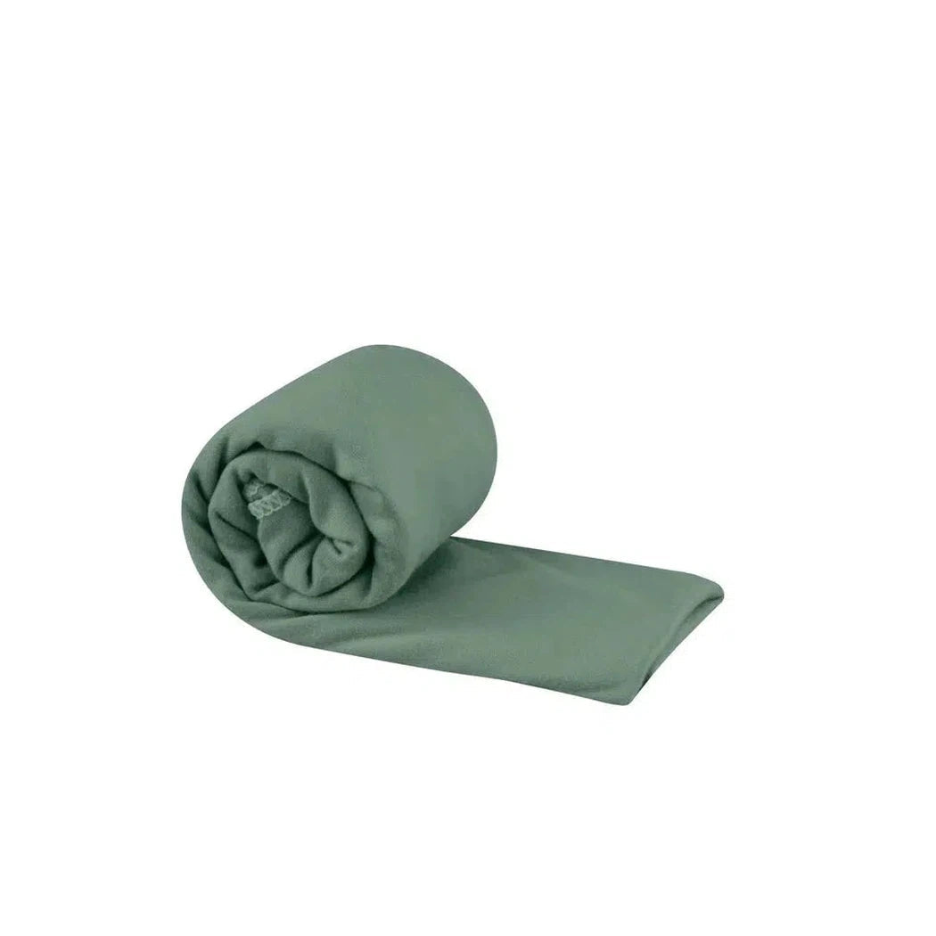 A rolled Sea To Summit Pocket Towel in Baltic Blue lies on a white background.