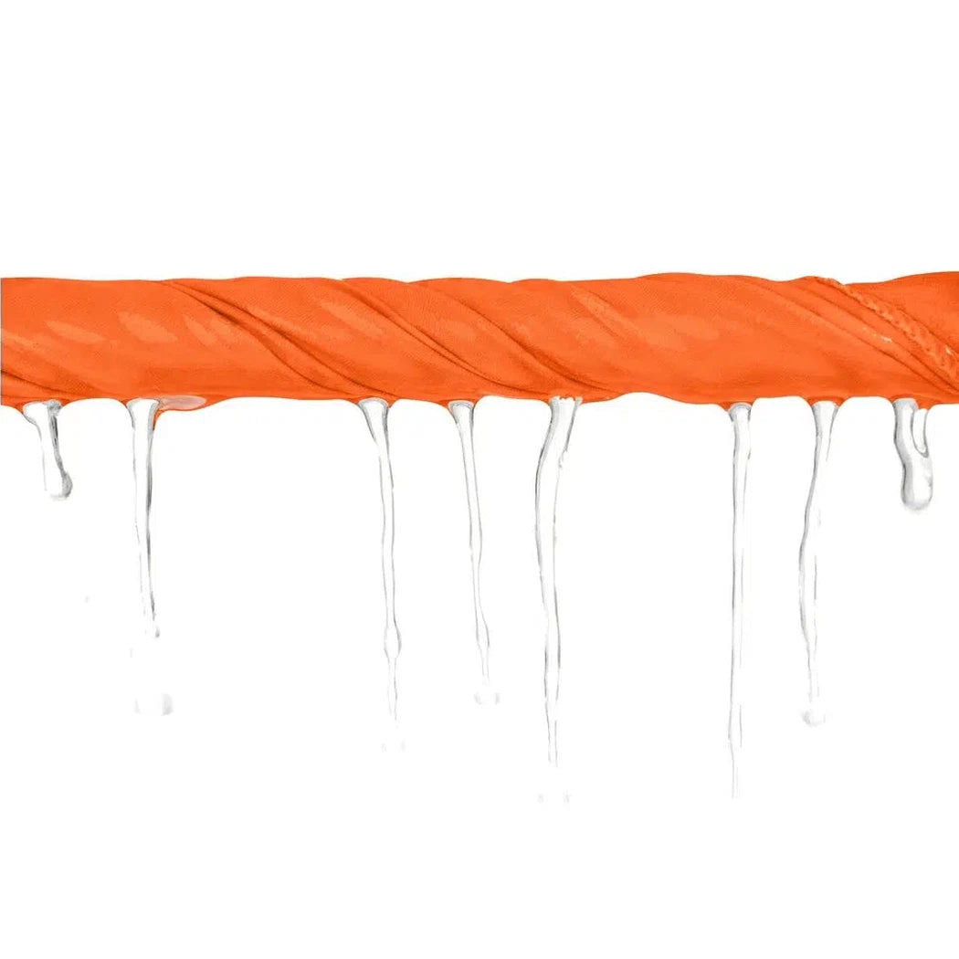 A Baltic Blue Sea To Summit Pocket Towel hangs with water droplets against a white background.