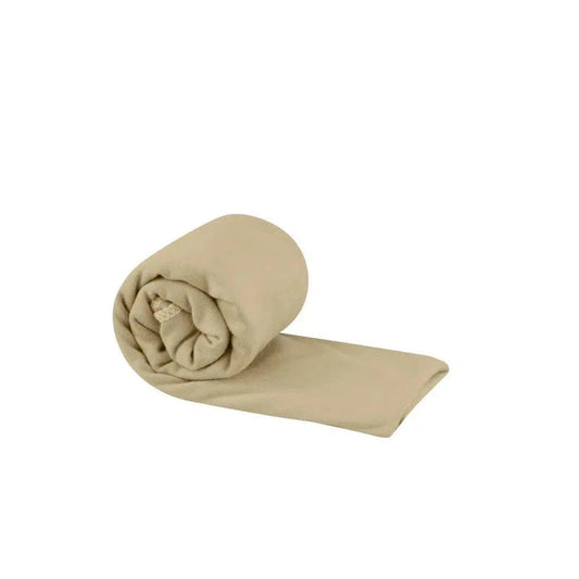 A rolled Sea To Summit Pocket Towel in Baltic Blue lies on a white background.