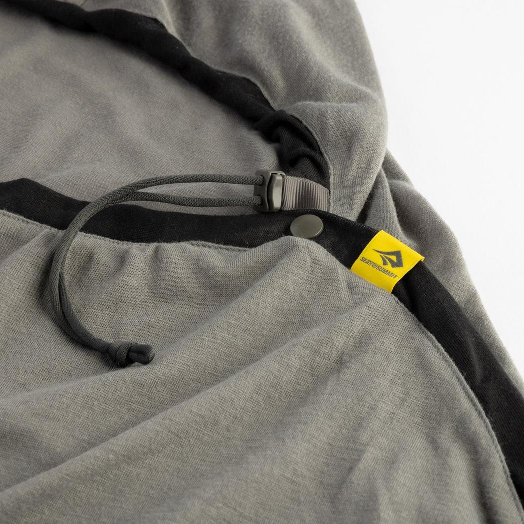 A close-up of the Sea To Summit Reactor Lightweight Liner - Regular in Charcoal/Graphite showing the drawcord and yellow tag against a white background.