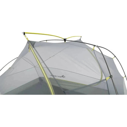 Top view of the Sea To Summit Telos Evo Tent showing its mesh structure and yellow support poles against a white background.