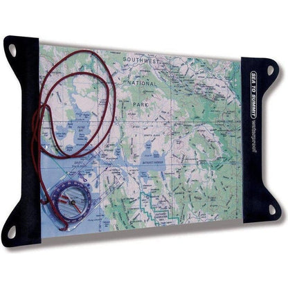 A Sea To Summit TPU Guide Map Case with a compass and red cord on a map of Southwest National Park.