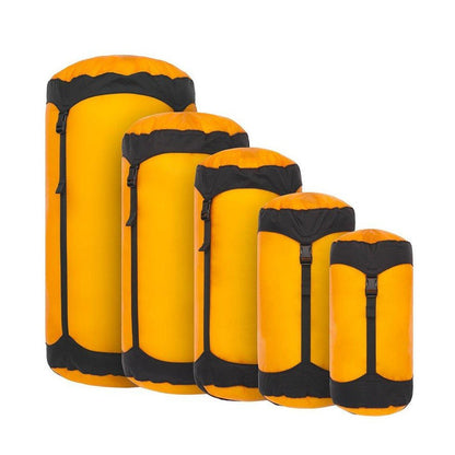 Side view of the Sea To Summit Ultra-Sil Compression Sack in Atoll Blue showing the compression straps against a white background.