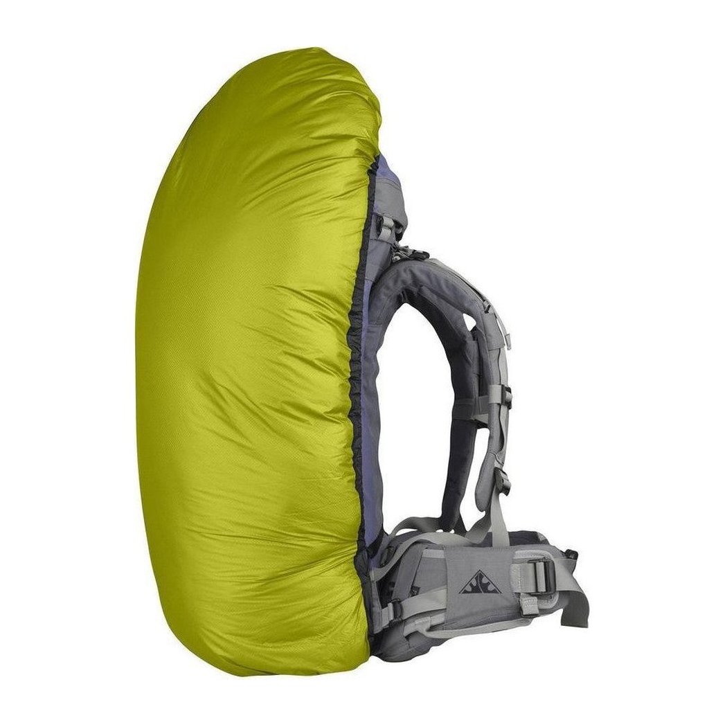 Side view of the Sea To Summit Ultra-Sil Pack Cover in Blue showing the backpack straps and a white background.