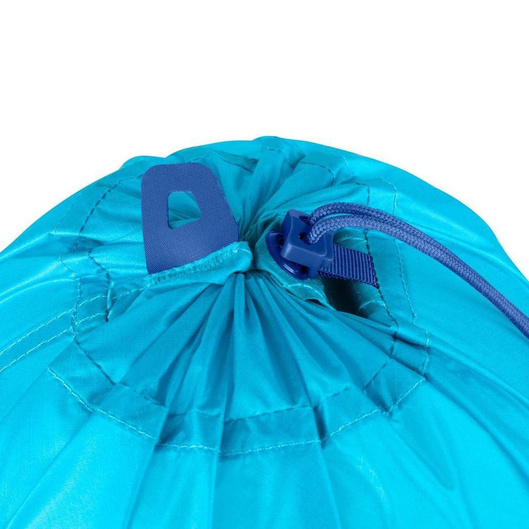 A close-up of the Sea To Summit Ultra-Sil Stuff Sack in Atoll Blue showing the drawstring closure and blue plastic clip against a white background.