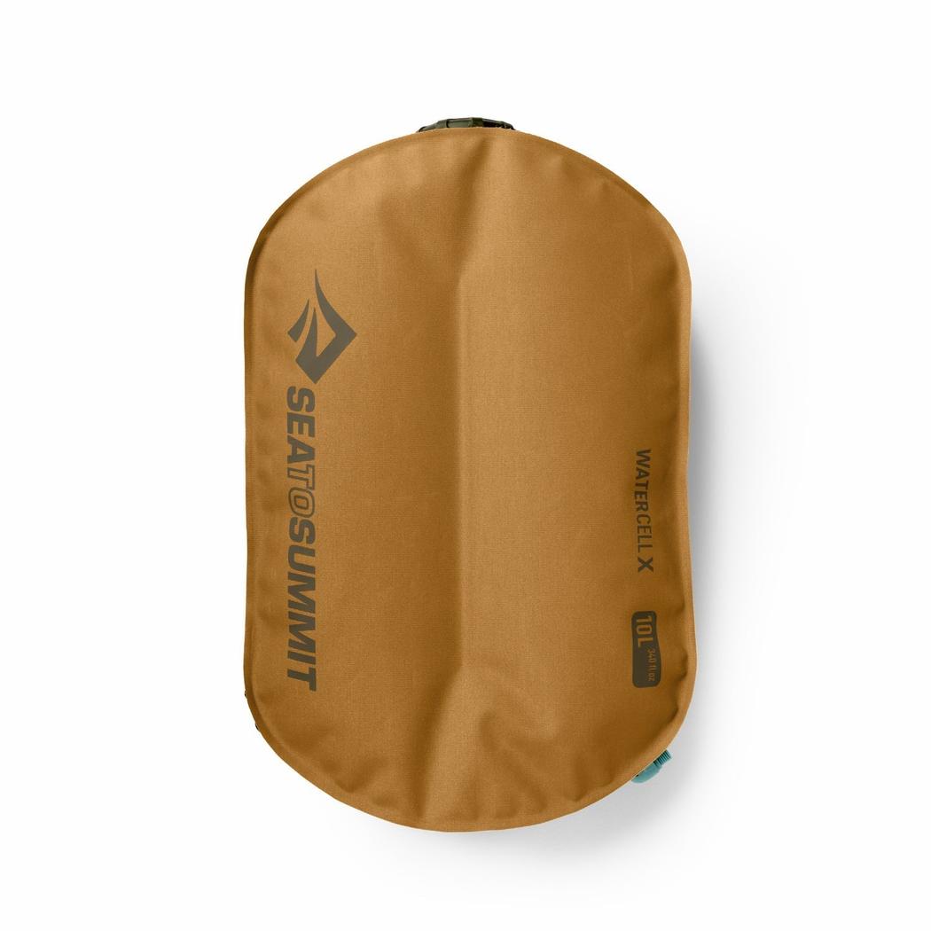 A top-down view of the Sea To Summit Watercell X 4L in tan showing the brand logo and a teal accent on the bottom right against a white background.