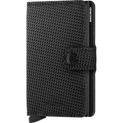 A front view of the SECRID Mini Wallet - Carbon in Black showing the textured surface and secure snap closure.