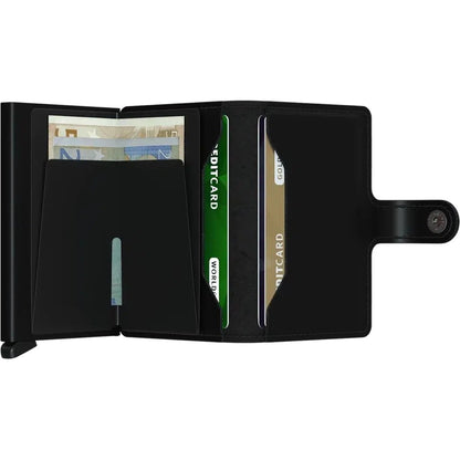 A black SECRID Mini Wallet - Matte open to show cards and cash against a white background.
