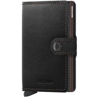 A front view of the SECRID Mini Wallet - Original in Black showing the snap closure and brand name embossed on the front.