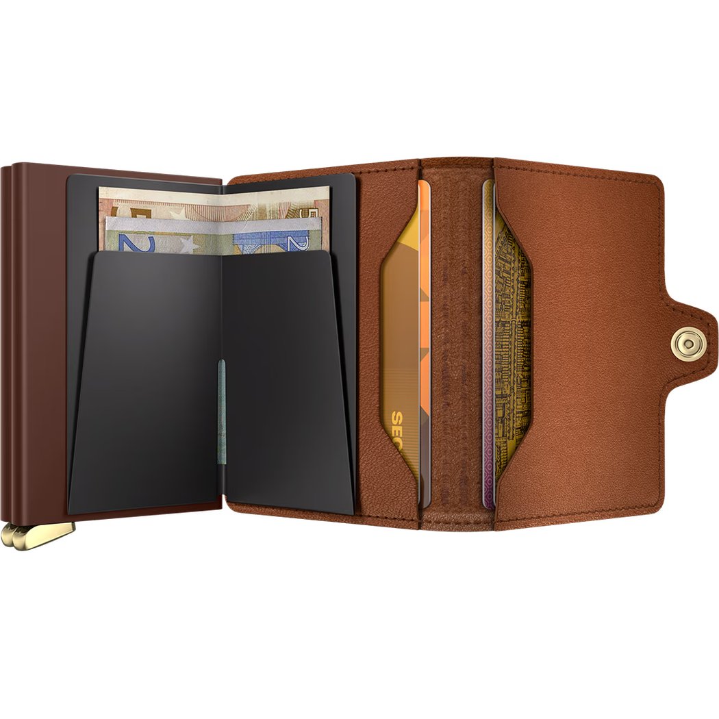 A close-up of the SECRID Premium Twinwallet Emboss Lines + in Cognac showing card slots and a cash compartment.
