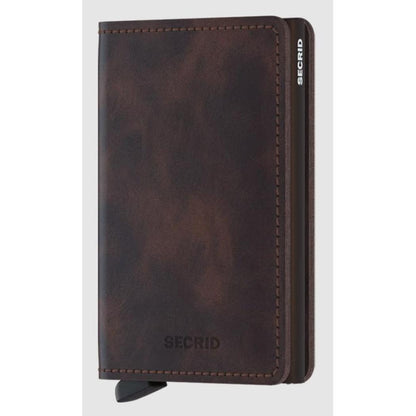 A front view of the SECRID Slim Wallet - Vintage in Black showing the brand name and a pull tab on the bottom.