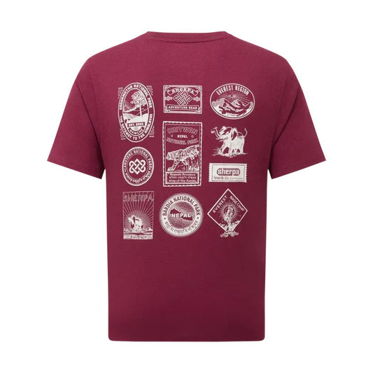 Back view of the Sherpa Adventure Gear Men's Jutnu Badge Tee in Wine showing various white badges on the back against a white background.