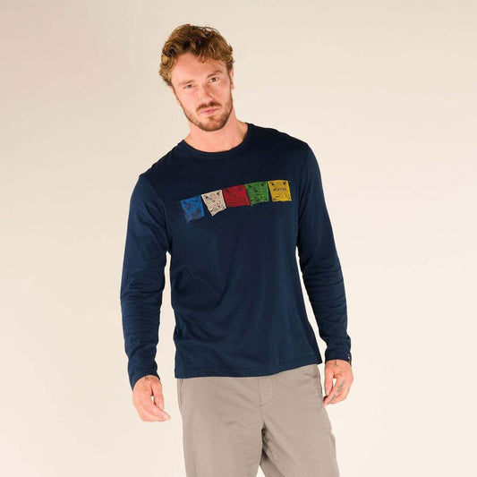 A model wears the Sherpa Adventure Gear Men's Tarcho Long Sleeve Tee in Rathee color against a plain white background.