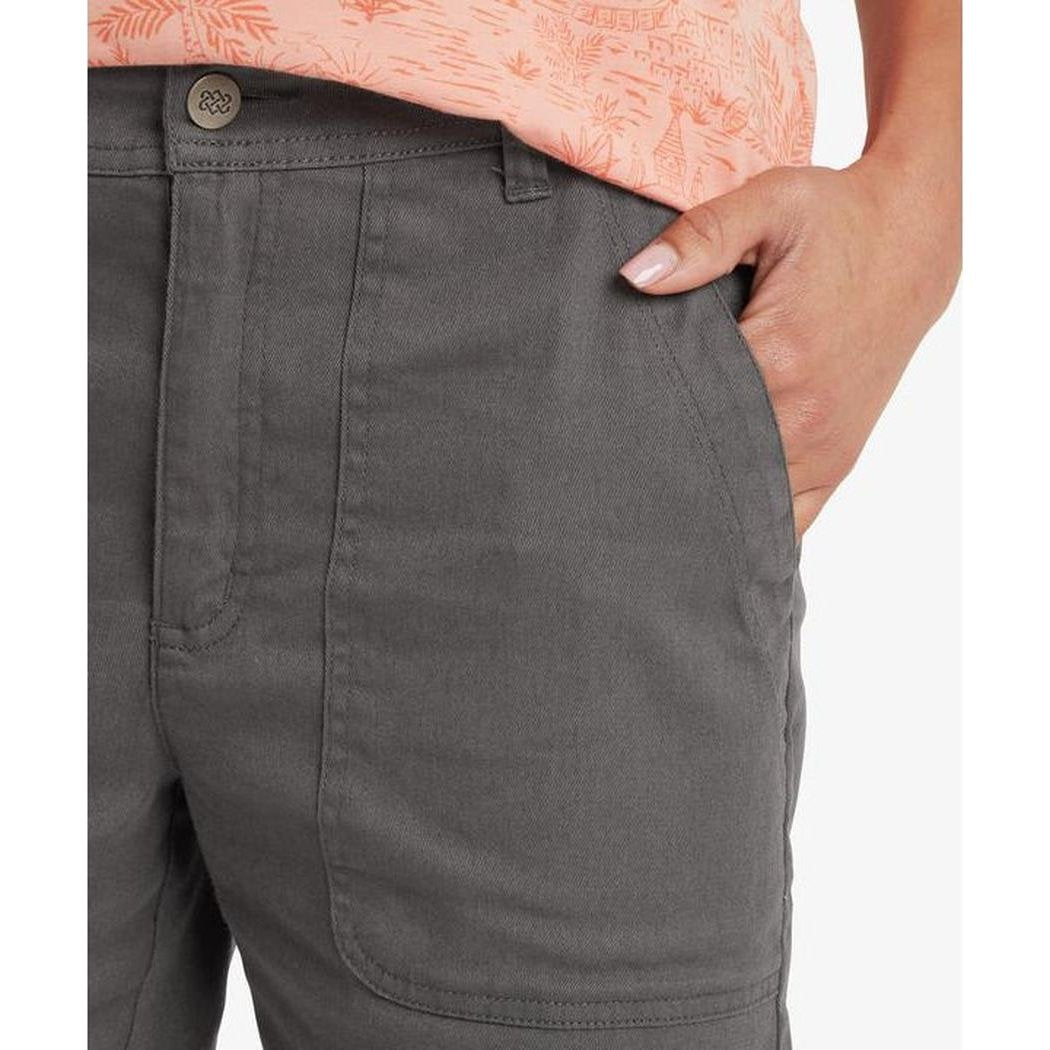 Side view of the Sherpa Adventure Gear Sample - Women's Dando Short in Evergreen showing the front pocket and model's hand in the pocket.