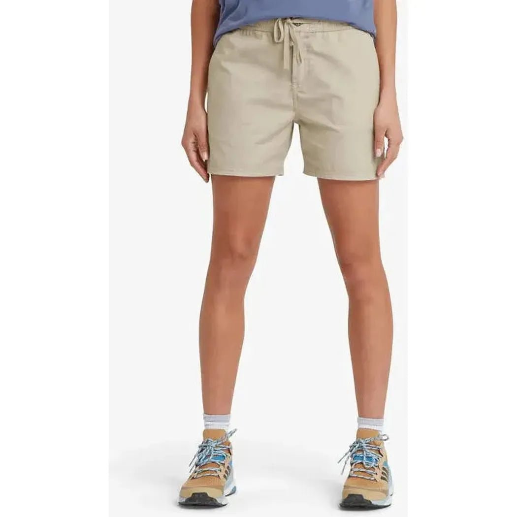 A front view of the Sherpa Adventure Gear Sample - Women's Ghoral Short in Bardaya Sand, showing the drawstring waist and model wearing it against a white background.