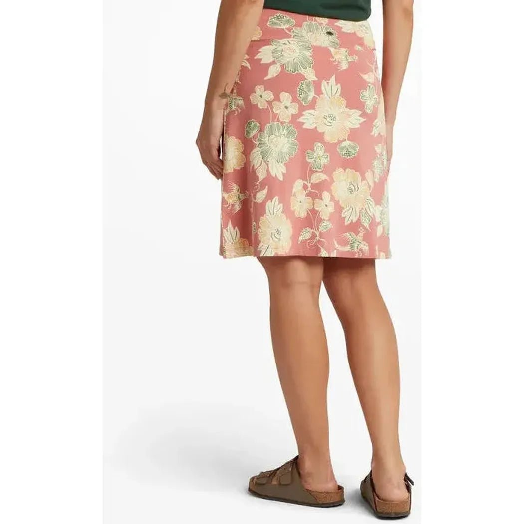 Back view of the Sherpa Adventure Gear Women's Padma Pull On Skirt in Floral Brick Dust Floral, showing the floral pattern and a model wearing it against a white background.
